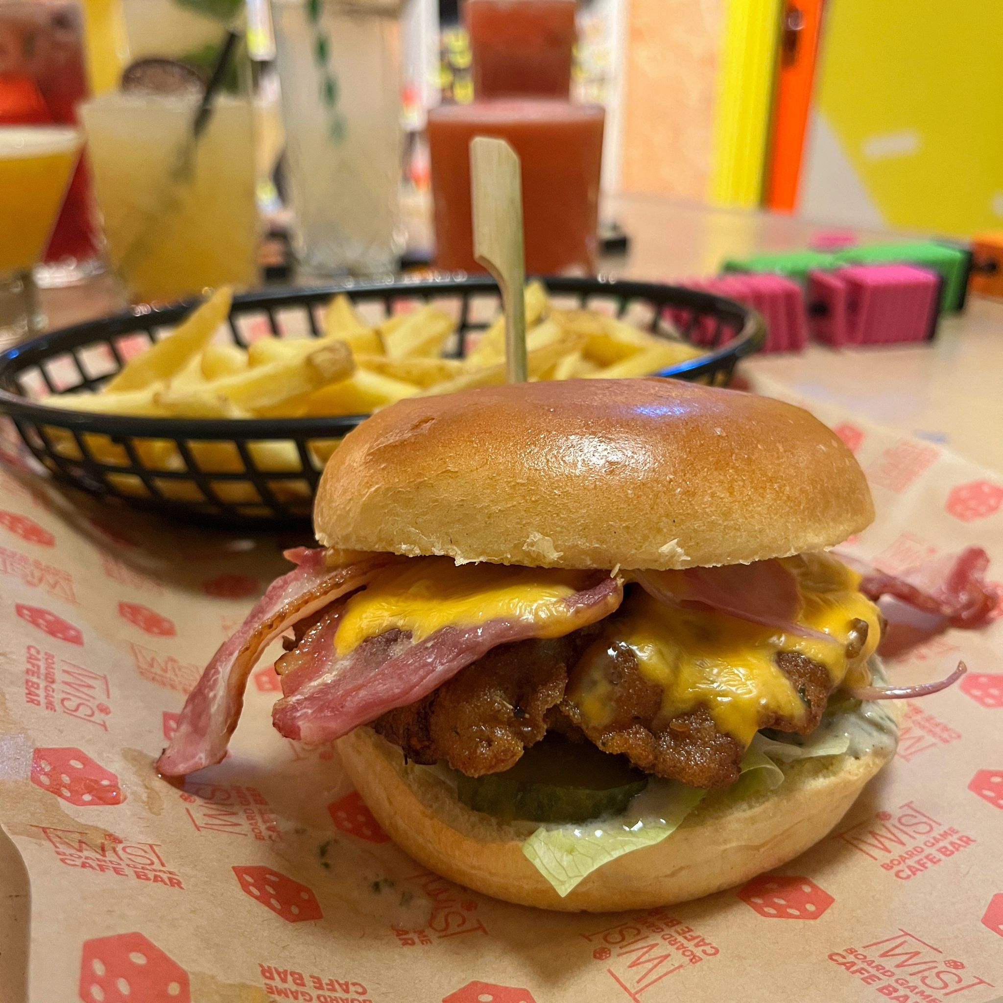 Burger and chips on wooden table in plymouth cafe